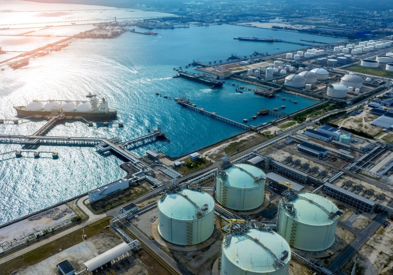 A view of an oil refinery with many tanks.